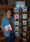 Dixie in front of her cards for sale at SPF